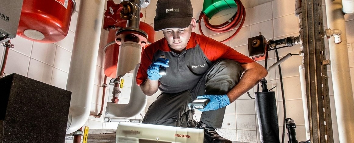 rentokil technician inspecting a product