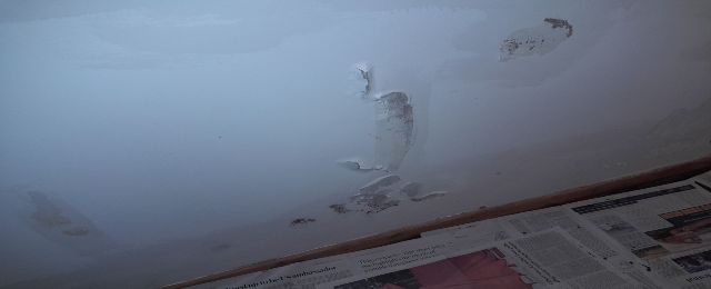 Paint and plaster lifting caused by penetrating damp