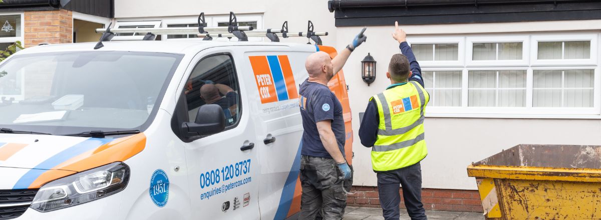 Peter Cox Commercial Market Sector Customers - Peter Cox surveyors inspecting a property from the exterior
