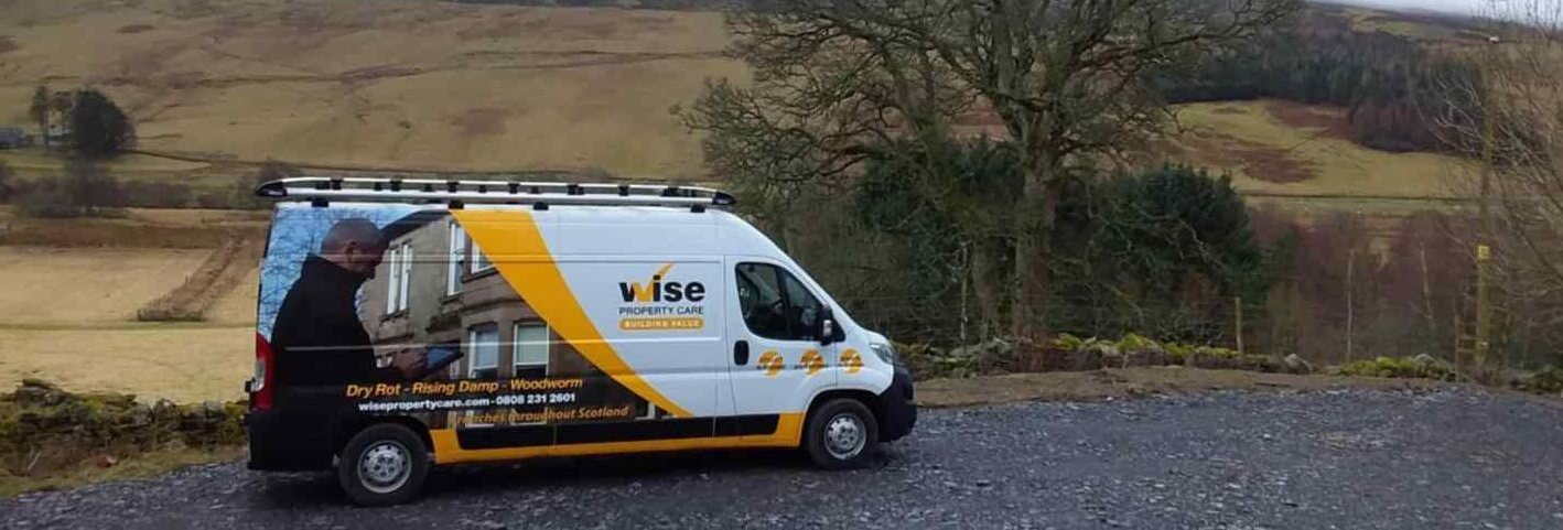 Wise Property Care technicians undertaking commercial damp proofing and timber treatment on a large business property