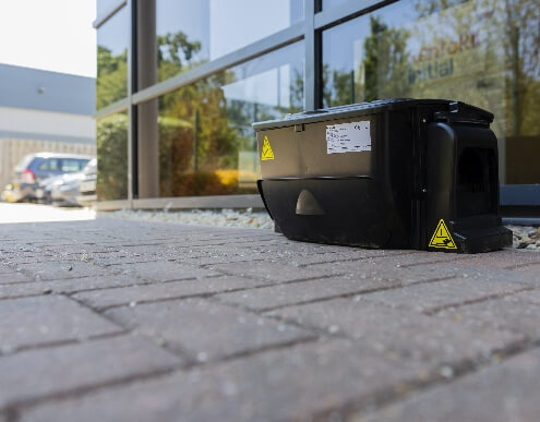 Eliminair Connect non-toxic multi-catch rat trap in-situ outside office building