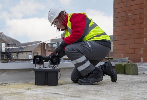 Rentokil Pest Technician installing commercial intellgent bird scarer unit 
