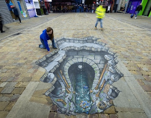 3D Artwork UnderOurFeet# depicting rat issues in sewers benath us with artist appearing to be looking over the edge into the rat infested area beneath them.