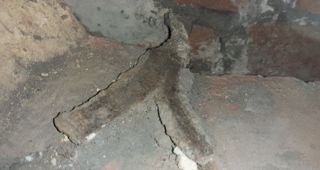 Ties can be inspected with a borescope or by removing a brick to assess the condition within the wall